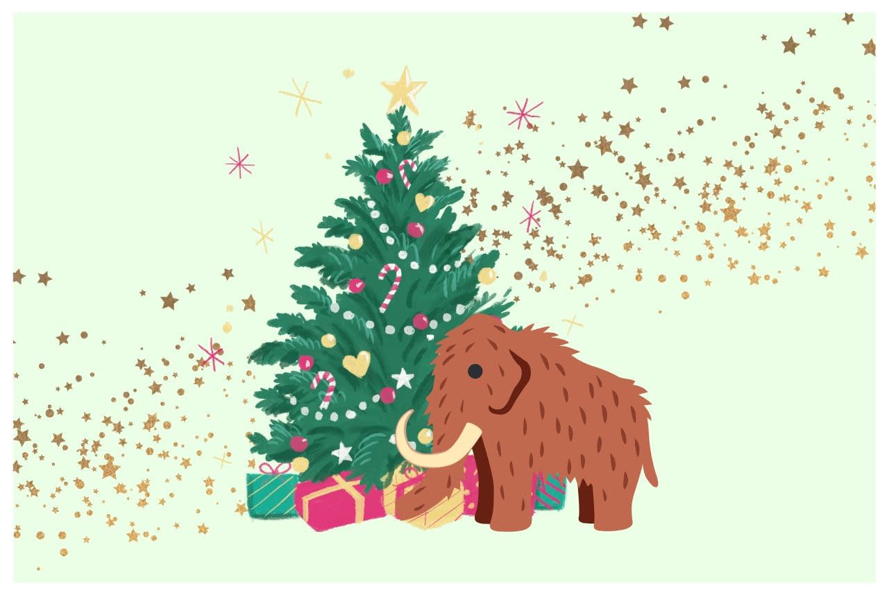 Un mammut davanti ad un albero di Natale pieno di decorazioni colorate e regali
